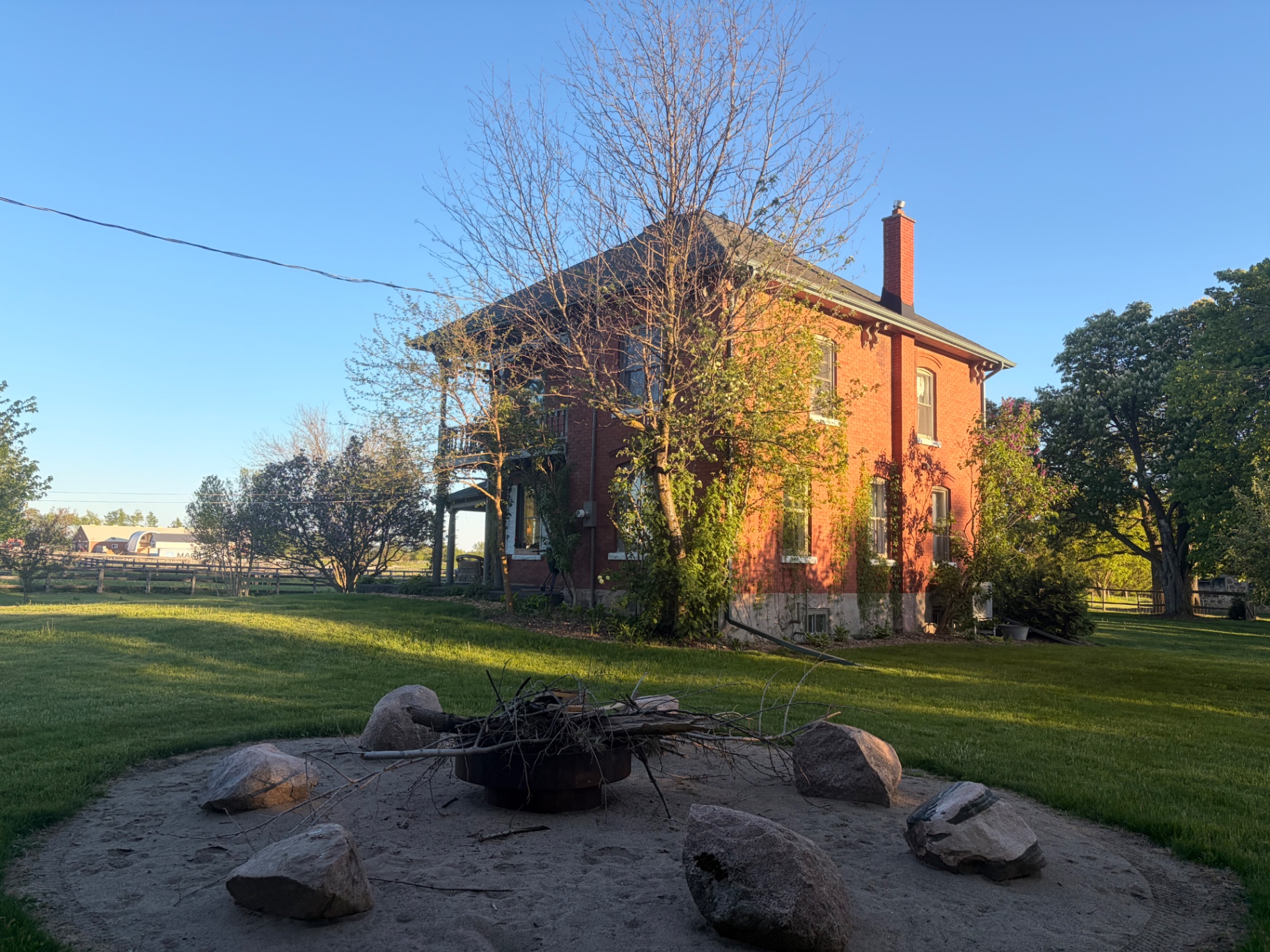 Original brick farmhouse before transformation